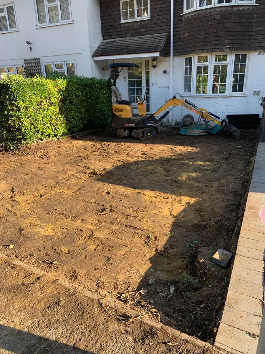A site dug out ready for foundations with a digger working