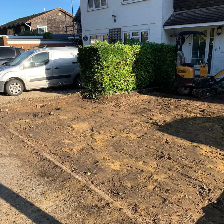 A front garden cleared and levelled with a van parked alongside