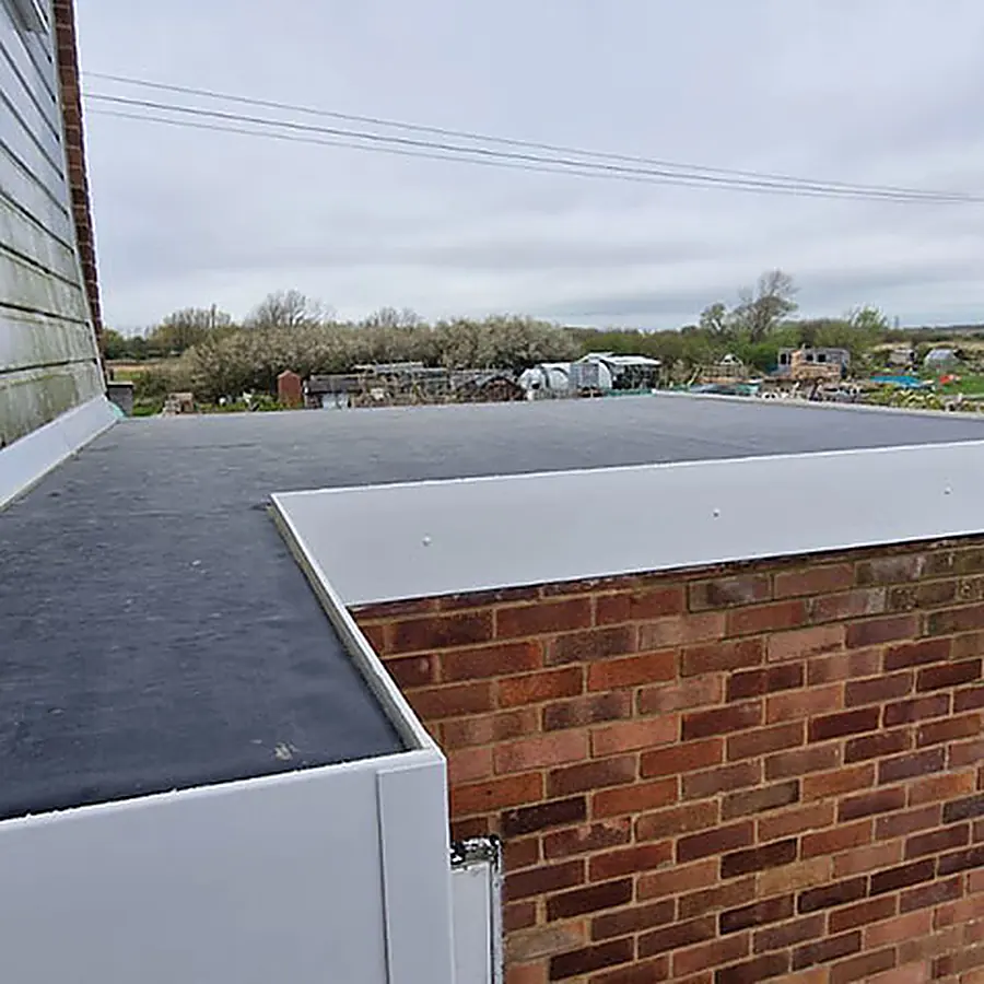 A new flat roof on a brick garage