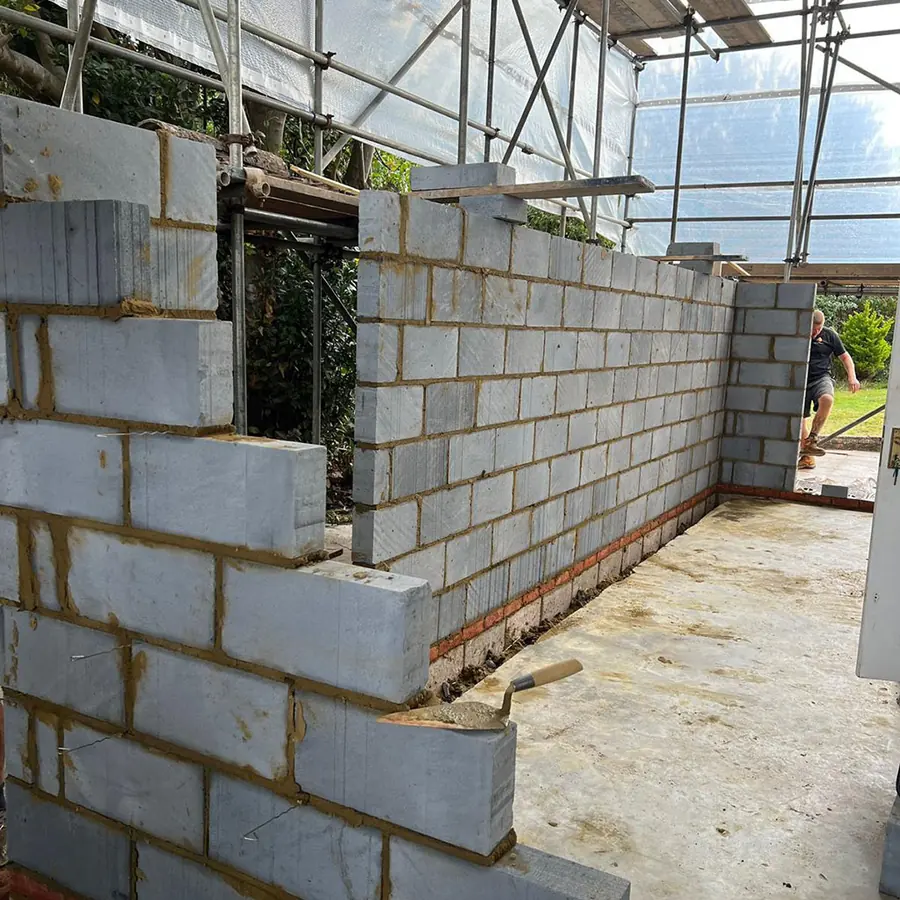 Blockwork walls going up on a new extension under scaffold