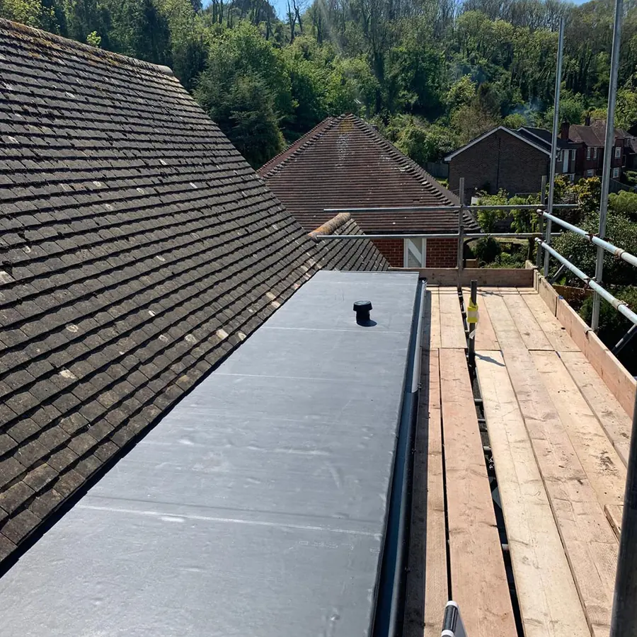 A flat roof being finished from the scaffold